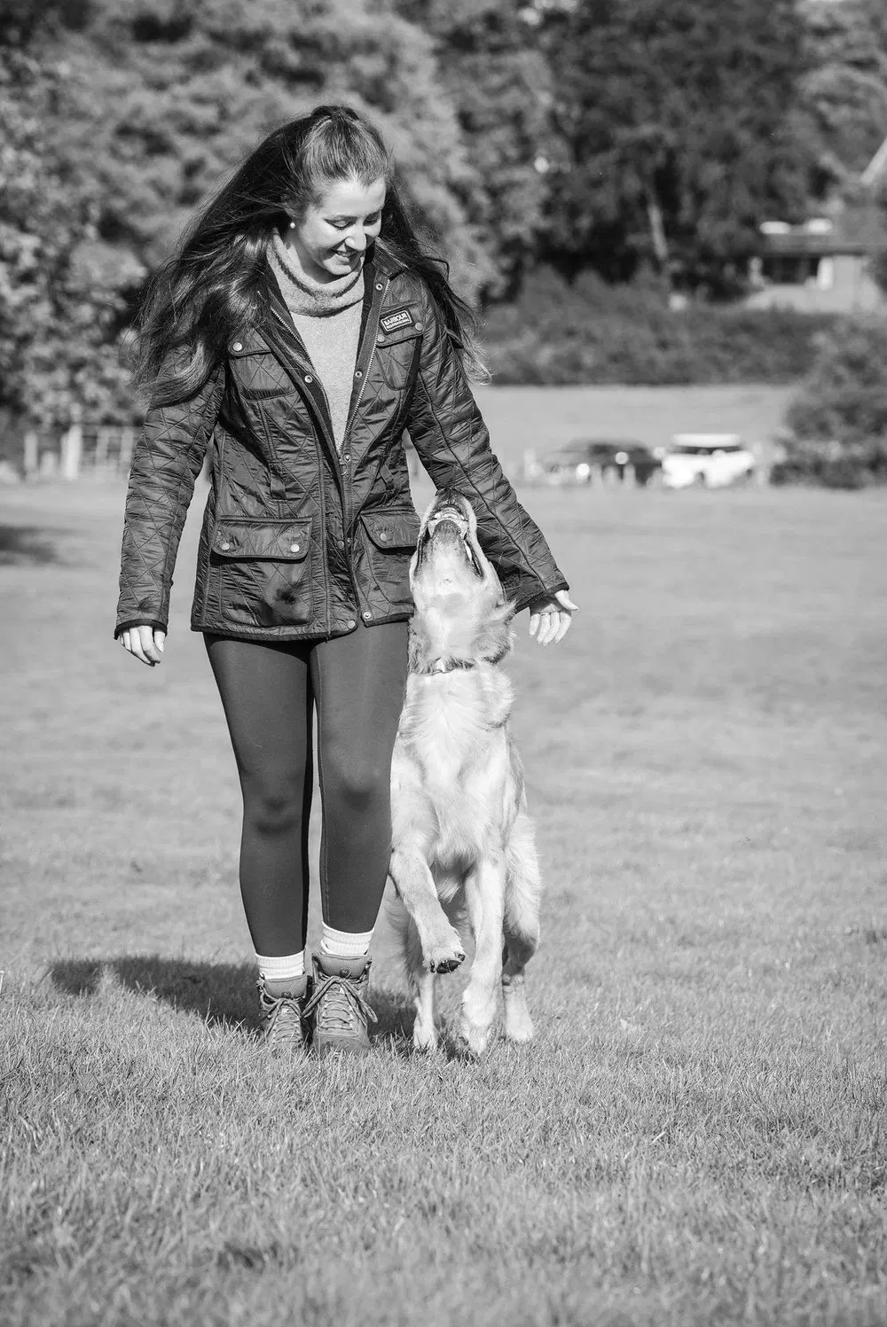 Handler walking a dog during an outdoor training session