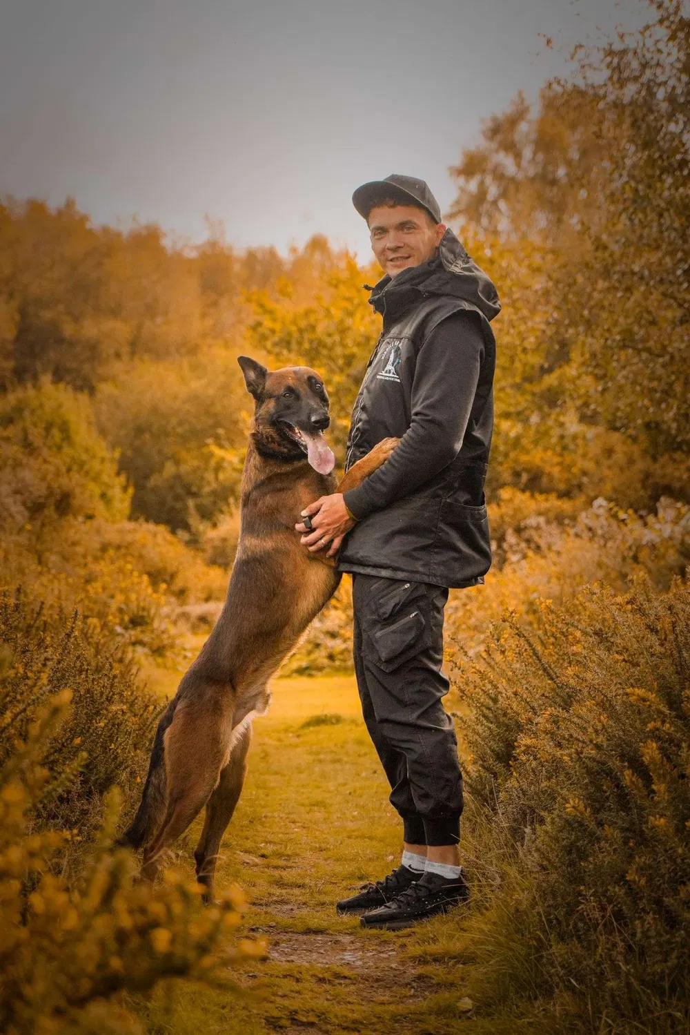 Andrejus practising controlled engagement with a working dog outdoors